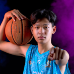Teen athlete standing confidently in stadium