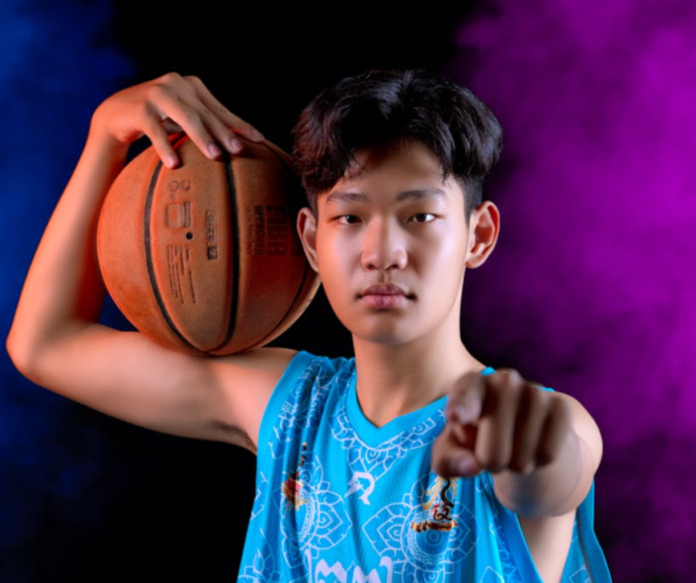 Teen athlete standing confidently in stadium